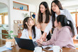 © themorningglory - Business women team discussion together with laptop com[puter in home office