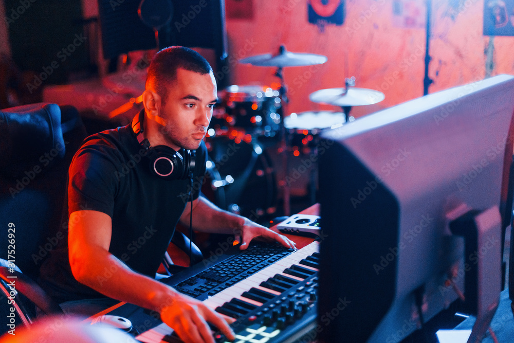 Sound engineer working and mixing music indoors in the studio Stock ...