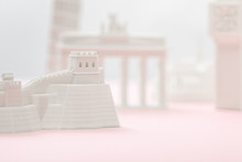 Selective Focus Of Small Great Wall Figurine Near Statuettes On Grey And Pink