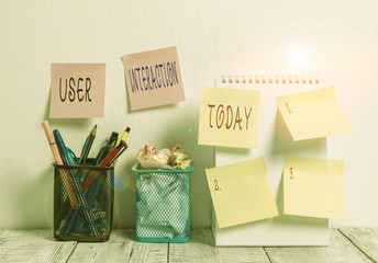 Fototapete - Word writing text User Interaction. Business photo showcasing the conduit between huanalysis and computer interaction 6 Sticky Notes on Wall Open Spiral Notebook 2 Pencil Pots on Work Desk