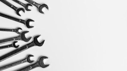 Set of spanner on white desk background. - industrial workshop hand tools concept.