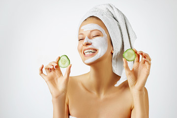 Wall Mural - cosmetology, skin care, face treatment, spa and natural beauty concept. woman with facial mask holds