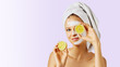 © Olesia - Cosmetology, skin care, face treatment, spa and natural beauty concept. Woman with facial mask holds lemons.