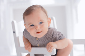 toddler child in a bright studio / little boy infant beautiful healthy child