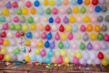 Wall of colored balloons for game at fair carnival