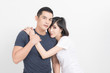 © Look Aod 27 - Portrait of happy young couple embracing in studio shot on white background.