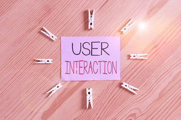 Fototapete - Handwriting text User Interaction. Conceptual photo the conduit between huanalysis and computer interaction Colored clothespin papers empty reminder wooden floor background office