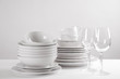 © New Africa - Set of clean dishes on white table