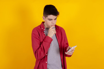 Poster - young teenage man with mobile phone isolated on background