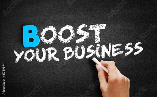Fotografía Boost Your Business text on blackboard, business concept background