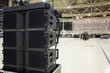 © Purple Moon - Flight cases with line array speakers. Installation of professional sound, light, video and stage equipment for a concert.