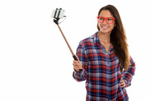Happy Young Beautiful Hipster Woman Taking Selfie With Phone On Selfie Stick