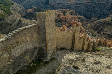 Wall Mural - Aerial panorama view of Albarracin in Teruel Spain, with red sandstone terracotta medieval houses, Moorish castle and ancient city walls  voted most beautiful Spanish village