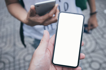 Mockup image blank white screen cell phone.man hand holding texting using mobile.background empty space for advertise text.people contact marketing business,technology 