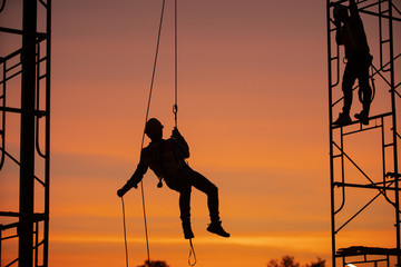 Sticker - Silhouette Construction site Engineers are abseiling with a zip line.