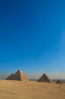 Great Cheops Pyramid and the smaller pyramids with downtown Cairo in the background