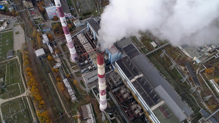 Wall Mural - State District Power Station aerial view. Steam comes from a high factory chimney.