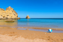 Beautiful Sandy Beach With Play Ball. Blue Ocean And Golden Cliffs, Lagos Portugal