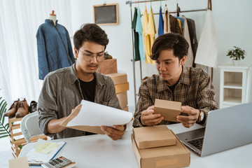 young asian people businessman chatting about product of packaging at work