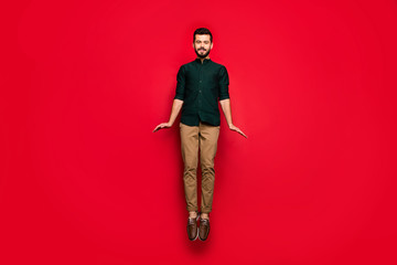 Sticker - Full body photo of positive cheerful guy have spring free tine relaxation jump wear brown casual style outfit isolated over red color background