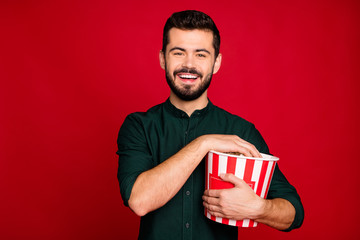 Sticker - Portrait of positive guy have break pause watch funny movie hold big red striped pop corn box enjoy recreation wear casual style clothes isolated over brights color background