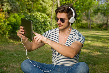 man relaxing with tablet pc