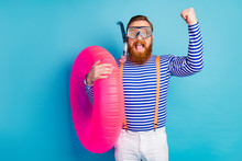 Crazy Man Win Coral Reef Exploration Raise Fists Scream Hold Float Circle Wear Goggles Breathing Tube Style Stylish Trendy Orange Suspenders White Shorts Isolated Blue Color Background