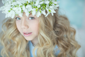 Wall Mural - Girl wreath of flowers. Girl with a wreath of flowers on her head.