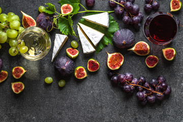 Wall Mural - Buffet with wine snack, mediterranean appetizer: wine, cheese and fruit.