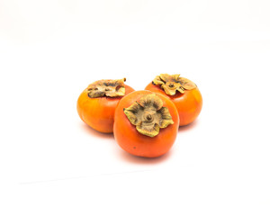 Wall Mural - Three Fuyu persimmon isolated