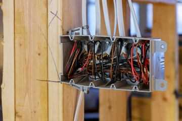 Wall Mural - Interior view of a electrical box with wiring in a new home under construction wooden beams