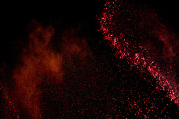 Wall Mural - red colorful holi paint explosion on black background