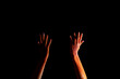 © LIGHTFIELD STUDIOS - cropped view of female hands with orange colorful holi paint powder isolated on black