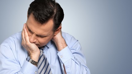 Wall Mural - Thoughtful businessman portrait on the background