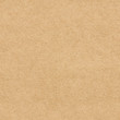 The surface of brown craft paper. Seamless texture background