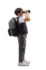 Poster - Schoolboy with a backpack looking through binoculars