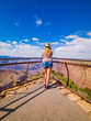 © arkanto - Sexy girl admires panorama of Grand Canyon National Park Desert View Point, northwestern Arizona: View of Steep-sided canyon carved by Colorado River in Arizona UNESCO WHS in 1979