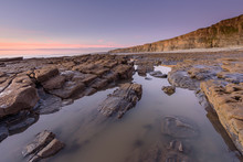 Calm Rock Pool At Nash Point Beach, South Wales, At Sunset