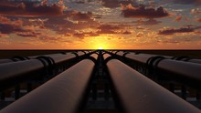 Pipeline Transportation Of Oil, Natural Gas Or Water Through Metal Pipes. Concept Of The Oil Refining Industry. The Camera Moves Over Six Pipeline Streams Right At Sunset. 4k Ultra HD 3840x2160