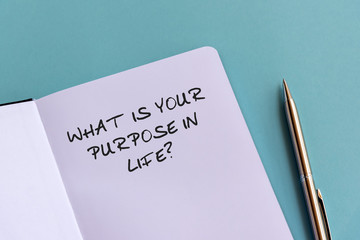 Wall Mural - What is your purpose in life? text on note pad on top of wood desk