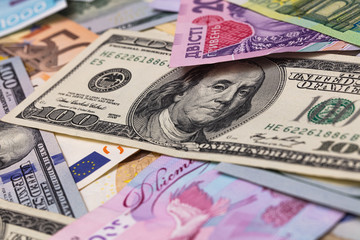 Closeup of dollar, euro and hryvnia banknotes 