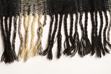 A Close-up Of A Fragment Of The Fringe Scarf Is Brown Black. Horizontal Location