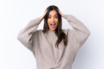 Young brunette woman over isolated white background with surprise expression