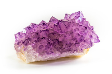 Wall Mural - Amethyst stone druse cluster, isolated on white background. Natural, purple amethyst stone close-up. Amethyst stone is one of the most using healing crystals.