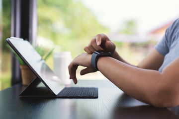 close up hand using smart watch technology