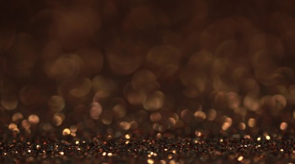 Brown bokeh holiday background. Magic shiny texture