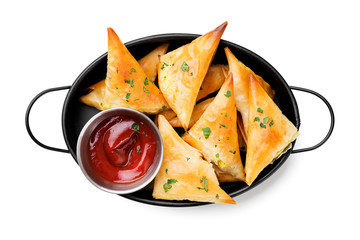 Vegetarian samsa (samosas)  with tomato sauce and herbs. Stuffed with potato. isolated on white background