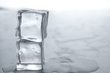 Fototapeta Łazienka - Wet ice cubes on white table, closeup. Space for text