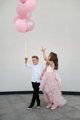 Wall Mural - young happy boy and girl together outside