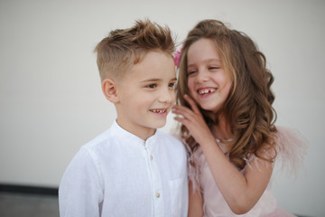 Wall Mural - young happy boy and girl together outside